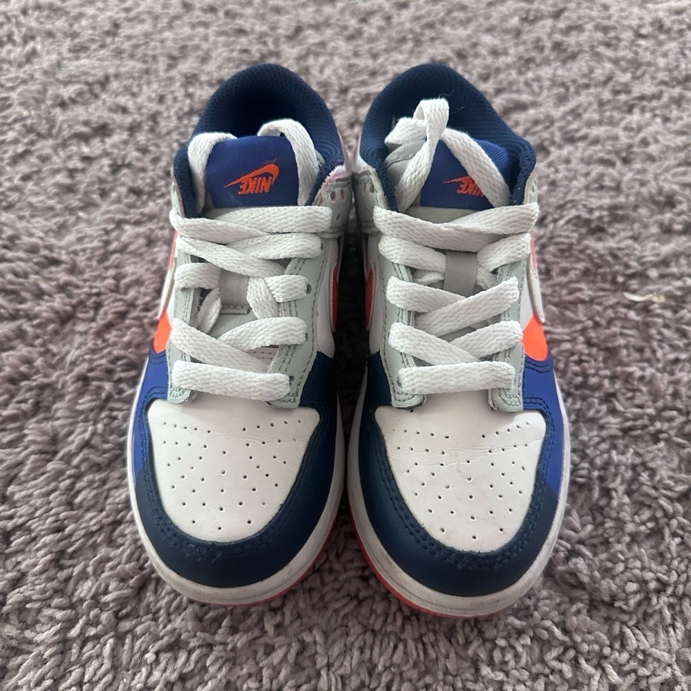 Preloved Nike Kids Navy and White Sneakers with Orange Accents